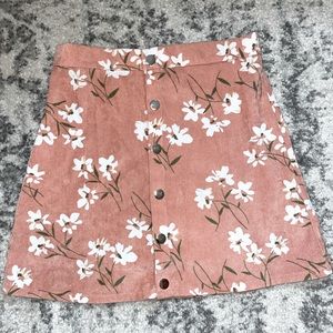 SHEIN a button up floral skirt.